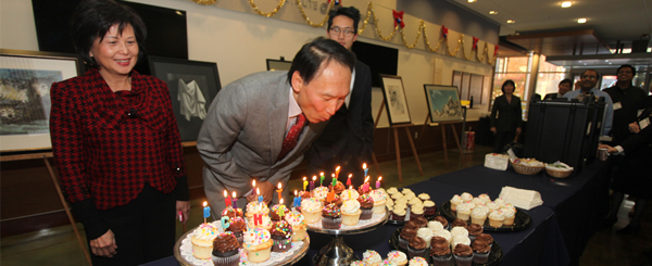Prof. Hu blowing out the birthday candles